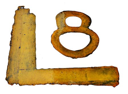 shiny painted number eight, wet from rain, isolated from asphaltの写真素材