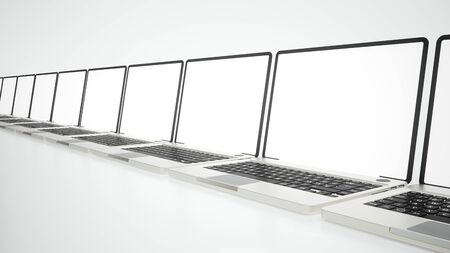 Several laptops on a white surface -- 3D renderingの写真素材