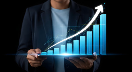 Businessman holding tablet with financial graph on the screen, stock market conceptの写真素材