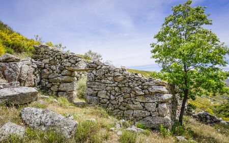 broken stone wall with doorの写真素材