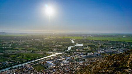 the sun over the horizon from the top of a mountain