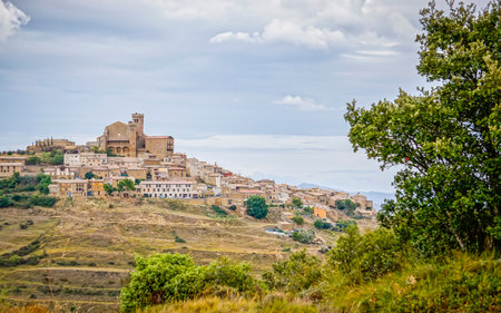 Overview of the town of Ujue in the autonomous community of Nacarra, with the fortress church of Santa Maria, a monumental complex of medieval originの写真素材