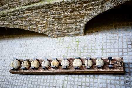 Old cannon balls displayed on a streetの写真素材