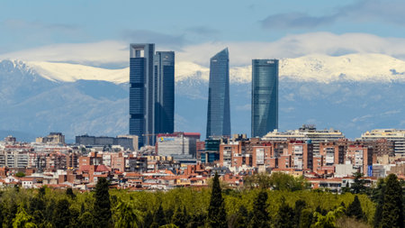 Panoramic view of Madrid, the capital of Spain, with the partially snow-covered mountains in the background.の写真素材