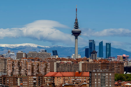Panoramic view of the capital of Spain, with the partially snow-covered mountains in the background.の写真素材