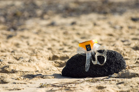 Diving glasses on the rockの写真素材