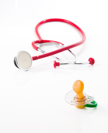 red stethoscope with green pacifier isolated