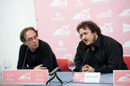LAS PALMAS, SPAIN-MARCH 16: Scheduling coordinator Luis Miranda Sebastian(l) and Sebastian Lingiardi(r), during LPA International Film Festival on March 16, 2012 in Las Palmas, Spainのeditorial素材