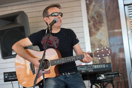 LAS PALMAS, SPAIN-SEPTEMBER 29, 2012: Guitarist Gustavo Alonso playing in the new band Diskonectid, from Canary islands, during a concert at music bar La Guarida del Blues.のeditorial素材