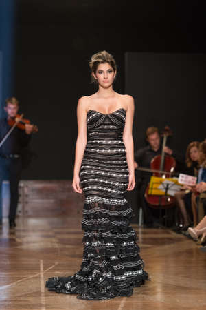 LAS PALMAS, SPAIN-MARCH 13, 2015: A model walks the runway wearing a wedding dress from designer Ogadenia Diaz during Gran Canaria Moda Calida 2016 Bridal Collection at Museum Nestor.のeditorial素材