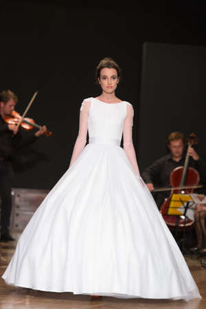 LAS PALMAS, SPAIN-MARCH 13, 2015: A model walks the runway wearing a wedding dress from designer Ogadenia Diaz during Gran Canaria Moda Calida 2016 Bridal Collection at Museum Nestor.のeditorial素材