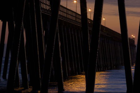 A Pier silhouetted at sunset