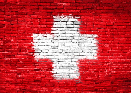 Switzerland flag painted on old brick wallの写真素材