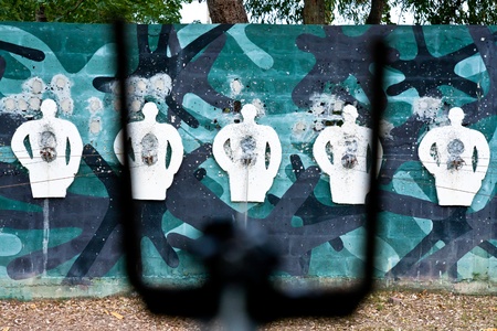 White human shaped shooting target on concrete wallのeditorial素材