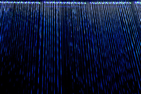 Abstract blue light lines striped on black background