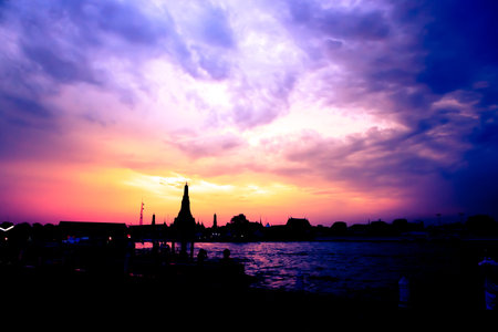 Cityscape of Wat Arun temple Bangkok in twilight time silhouette