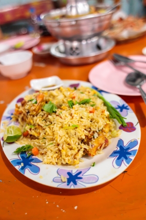 Fried rice with shrimp on dish on dining tableの写真素材