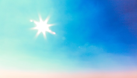 Sun beam and flare with blue skyの写真素材