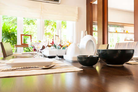 Group of kitchenware on wooden dining tableの写真素材