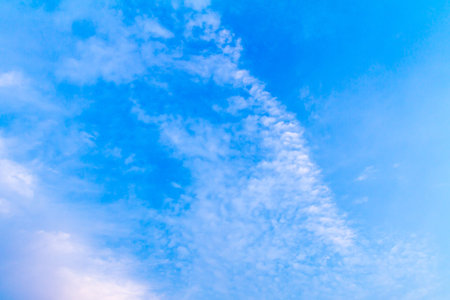 Clear blue sky with clouds in summer background