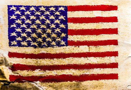 USA flag painted on old brown paper surface backgroundの写真素材