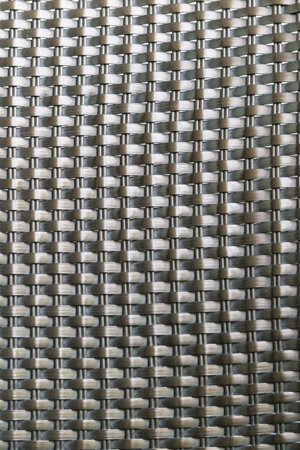 Dark brown woven plastic background texture