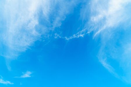 Dramatic cloudy blue sky in day time backgroundの写真素材