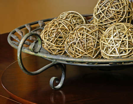 wicker balls in decorative platterの写真素材