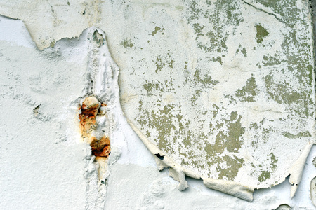Peeling white paint on plasterの写真素材