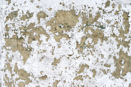 Peeling paintwork and plaster on old buildingの写真素材