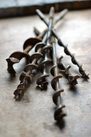 Old hand drill bits in a workshop, augers