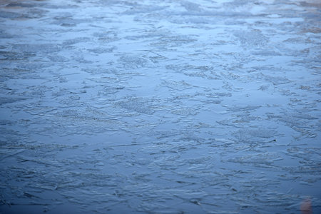 Patterns created in the ice on a frozen lakeの写真素材