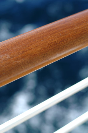 Cruise ship wooden rail with sea in background