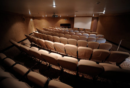 A small private movie theater, cinema with seats