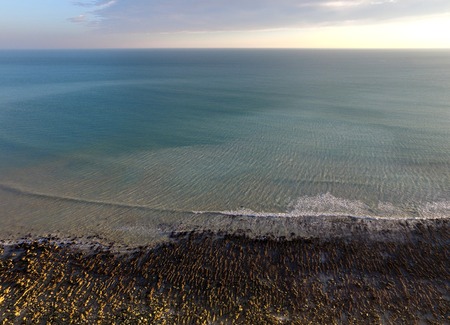 Aerial view of coast showing sea and rock poolsの写真素材