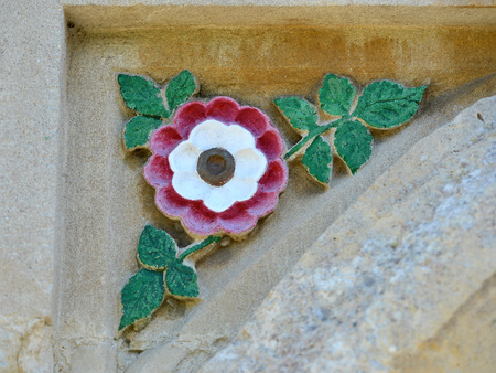 Rose, carved in sandstone and painted red and whiteの写真素材
