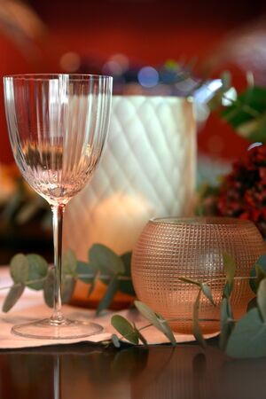 Christmas dining table fully dressed with decorations and foliage.の写真素材