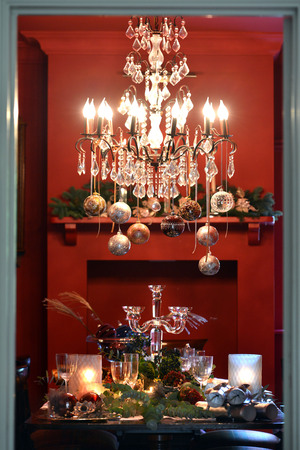 Christmas dining table fully dressed with decorations and foliage.の写真素材