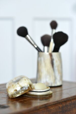 Makeup brushes in a horn container, luxury bathroomの写真素材