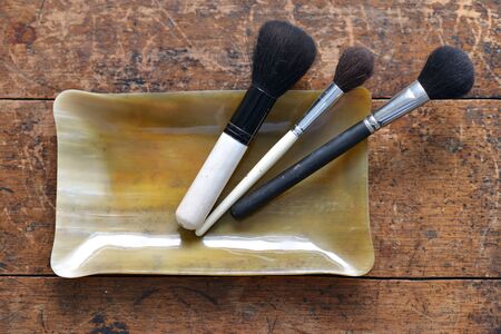 Makeup brushes in a horn container, luxury bathroomの写真素材