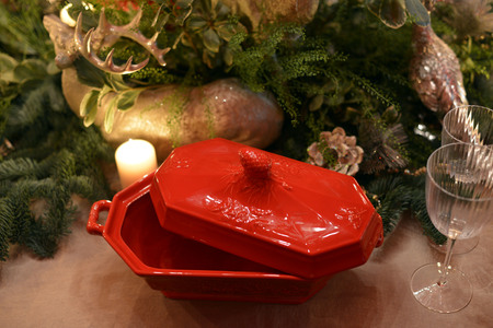 Decorated Christmas table with animal figures and colorful platesの写真素材