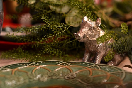 Decorated Christmas table with animal figures and colorful platesの写真素材