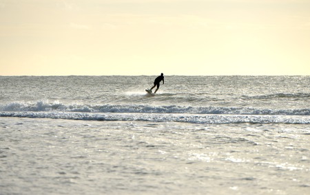 Jetsurfer using powered surfboard on a calm seaの写真素材