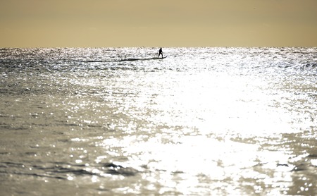 Jetsurfer using powered surfboard on a calm seaの写真素材