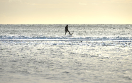 Jetsurfer using powered surfboard on a calm seaの写真素材