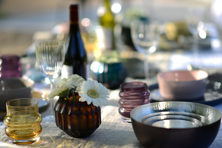 Alfresco dining, table set for an evening meal outsideの写真素材
