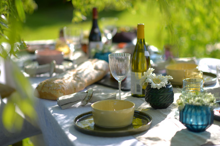 Alfresco dining, table set for an evening meal outsideの写真素材