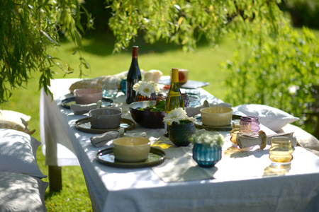 Alfresco dining, table set for an evening meal outsideの写真素材