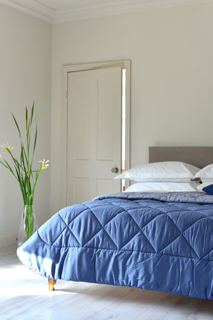 Bedroom setting with luxury pillows, shams and duvetsの写真素材