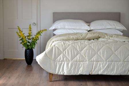 Bedroom setting with luxury pillows, shams and duvetsの写真素材